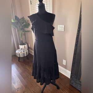 Black eyelet one shoulder dress.